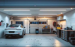 Well-lit and organized home garage with a car parked inside