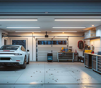 Well-lit and organized home garage with a car parked inside