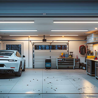 Well-lit and organized home garage with a car parked inside