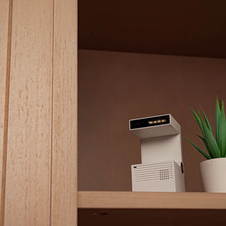 Motion-detecting camera placed on a shelf, blending discreetly with home decor